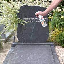 person holding yellow plastic spray bottle